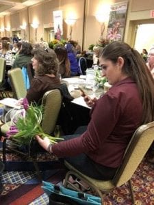 Rachel Kilpeck of Meries Flowers in Seward, Nebraska, takes a quick shot during one of the interactive Profit Blast sessions.