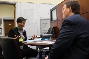 Stacie Lee Banks of Lee's Flower and Card Shop, Inc. in Washington, D.C., discusses industry issues with a member of the staff of Congresswoman Eleanor Holmes Norton.