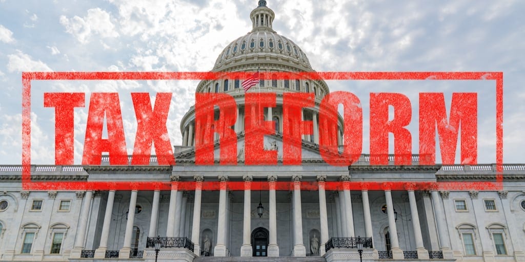 the capitol in DC with the words Tax Reform written in red