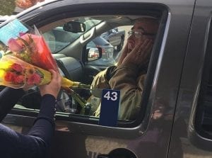 A surprised recipient reacts to the gift of flowers from Flowers, Etc., in Dixon, Illinois