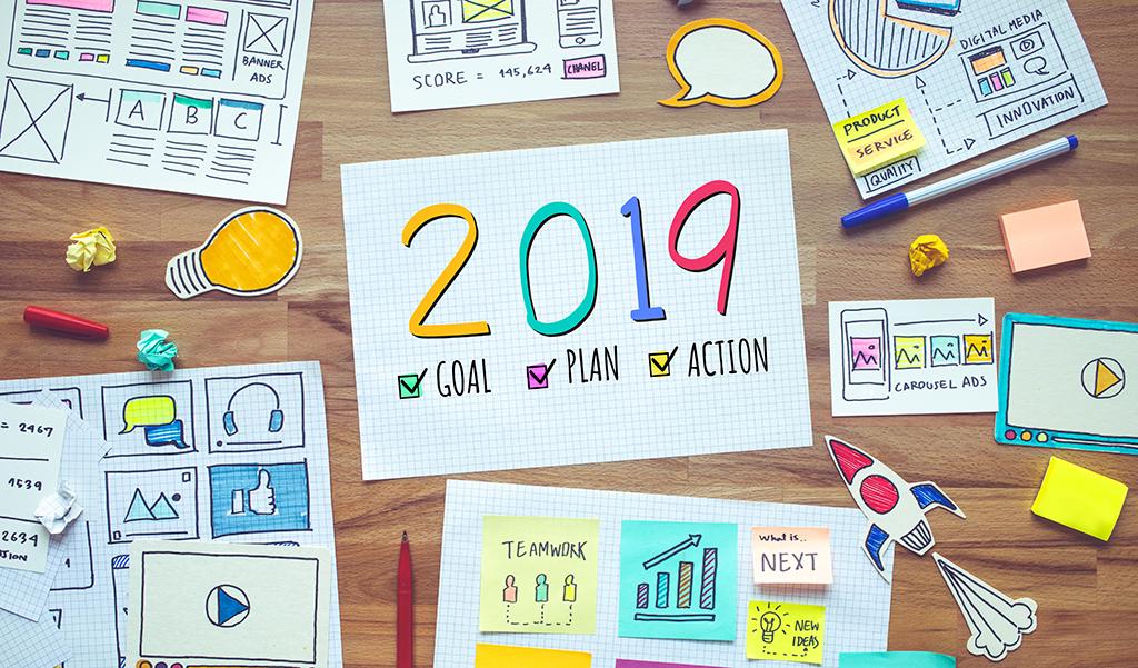 2019 new year resolutions with business digital marketing and paperwork sketch on wood table.analysis strategy concepts ideas